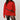 Woman wearing a red sweater with a black belt against a plain background